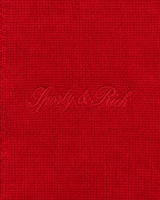 Jannie Signature Logo Cashmere SS Cardigan in Ruby featuring a short-sleeve button-up design with a collar and cropped length, laid flat on a white background.