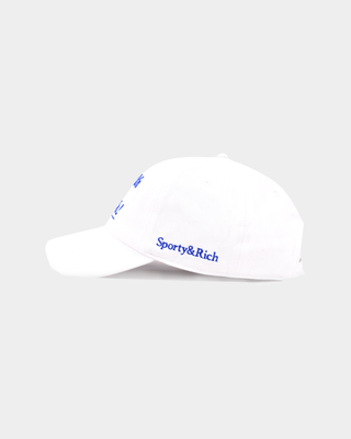 Maeve Health is Wealth Hat - White: a vintage baseball cap with an adjustable back and blue embroidered text.