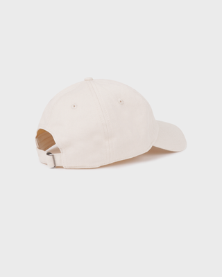Cream Maeve Ski Club Hat embroidered with St. Moritz Ski Club in black script and red block letters.