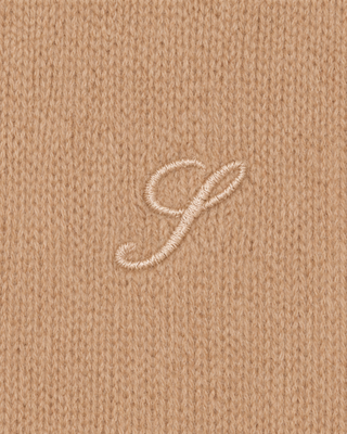 S Logo Cashmere Trousers in camel: tan wide-leg knit style with an embroidered hip logo and drawstring waist.