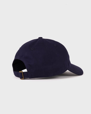 The Maeve Serif Logo Hat in Dark Navy features “Sporty & Rich” embroidered in white on the front and includes an adjustable back closure for a comfortable fit.