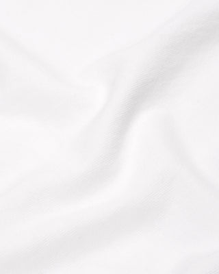 The Brianno Serif Logo Embroidered Jogger in White features elastic cuffs and waistband, front pockets, and a small embroidered Sporty & Rich logo on the left hip, offering a classic jogger fit inspired by their iconic sweatpants.