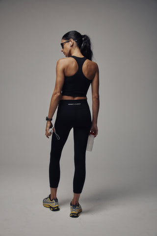 Bonnie Bold Logo Legging - Black, shown against a plain white background, features a high-waisted design for a supportive fit and is crafted from opaque activewear material.