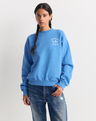 True blue Emmett Bh Riding Club Crewneck featuring a white graphic of a horse and rider on the left chest.