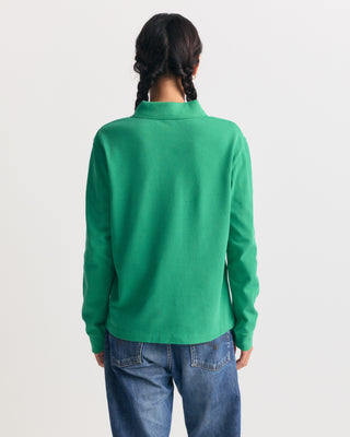 Kelly Perry Riding Club Longsleeve Pique Polo with a chest pocket and a circular logo patch.