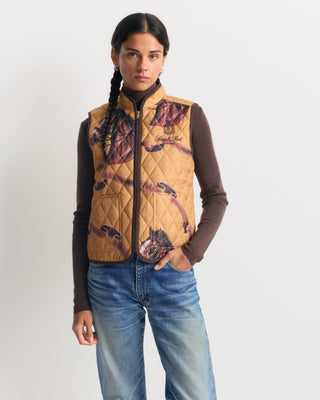 Gemma Vendome Quilted Riding Vest - Camel/Chocolate, a tan quilted equestrian vest with a horse and ribbon print.