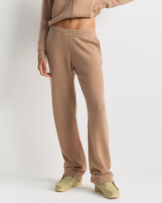 S Logo Cashmere Trousers in camel: tan wide-leg knit style with an embroidered hip logo and drawstring waist.
