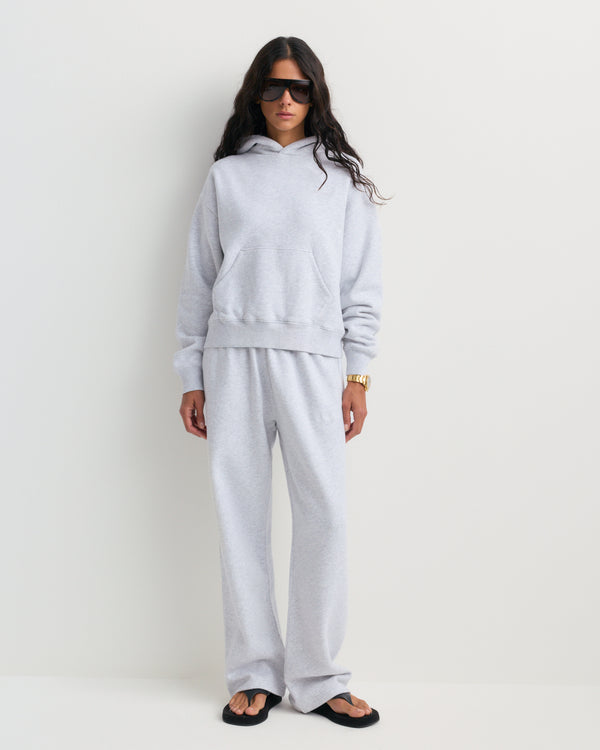 The Basilo Serif Logo Embroidered Wide Sweatpant in heather gray, featuring side pockets and an elastic waistband, is laid flat on a white background.