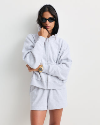 Heather gray Lucy Serif Logo Embroidered Disco Short, crafted from 100% cotton with an elastic waistband and side pockets, displayed on a white background—perfect sporty lounge shorts for comfortable everyday wear.