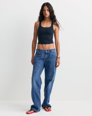 Baggy Jean - Indigo Wash laid flat on a white background, featuring front pockets and belt loops for a relaxed leg fit.