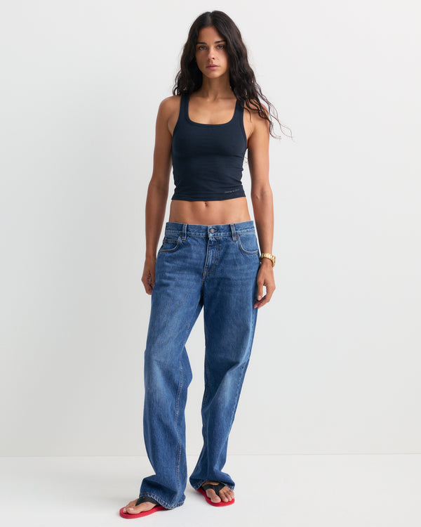 Baggy Jean - Indigo Wash laid flat on a white background, featuring front pockets and belt loops for a relaxed leg fit.