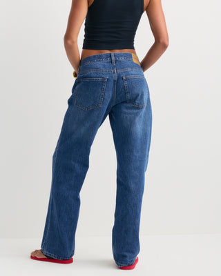 Baggy Jean - Indigo Wash laid flat on a white background, featuring front pockets and belt loops for a relaxed leg fit.