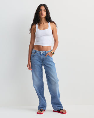 Baggy Jean - Light Wash: Classic high-waisted, straight-leg denim jeans in a light blue wash with subtle fading, featuring a five-pocket design and relaxed baggy fit, displayed on a white background.