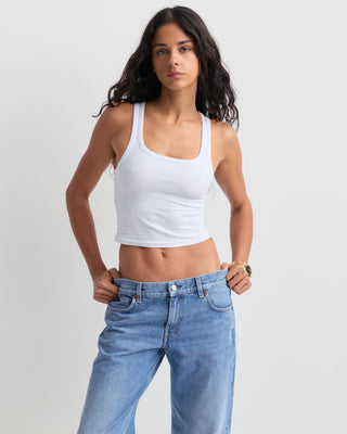 Baggy Jean - Light Wash: Classic high-waisted, straight-leg denim jeans in a light blue wash with subtle fading, featuring a five-pocket design and relaxed baggy fit, displayed on a white background.
