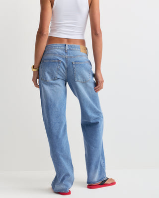 Baggy Jean - Light Wash: Classic high-waisted, straight-leg denim jeans in a light blue wash with subtle fading, featuring a five-pocket design and relaxed baggy fit, displayed on a white background.