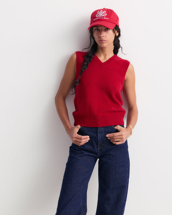 Inao Signature Logo Cashmere Vest in Ruby, a sleeveless V-neck design in vibrant red cashmere, laid flat on a plain white background—ideal for stylish cold-weather layering.