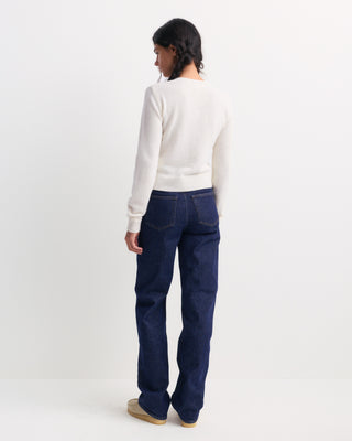 The Iba S Logo Cashmere Henley in Off White features long sleeves, ribbed cuffs and hem, and a three-button placket at the collar. Crafted from a luxurious cashmere-wool blend, this sweater offers both warmth and timeless style.