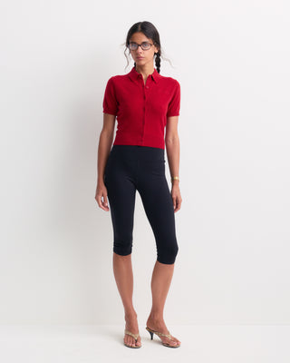 Jannie Signature Logo Cashmere SS Cardigan in Ruby featuring a short-sleeve button-up design with a collar and cropped length, laid flat on a white background.