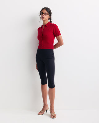 Jannie Signature Logo Cashmere SS Cardigan in Ruby featuring a short-sleeve button-up design with a collar and cropped length, laid flat on a white background.
