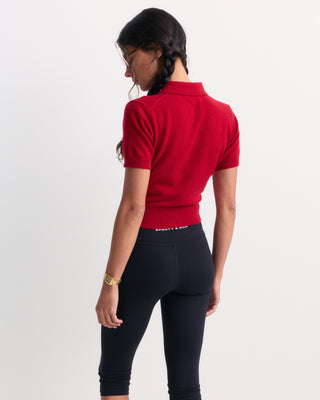 Jannie Signature Logo Cashmere SS Cardigan in Ruby featuring a short-sleeve button-up design with a collar and cropped length, laid flat on a white background.