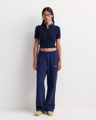 Jannie Signature Logo Cashmere SS Cardigan in Dark Navy—this cropped, short-sleeve knit features a button front, classic collar, and subtle signature embroidery on the left chest for a modern touch.