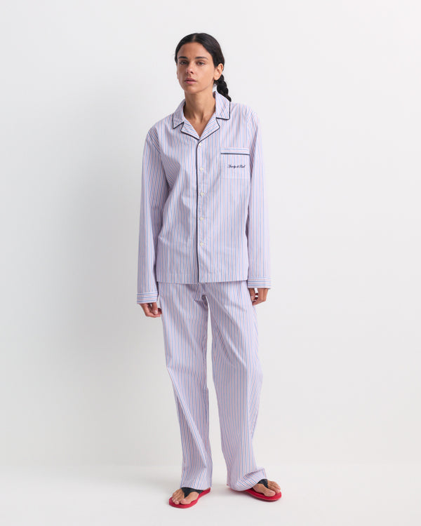 Brice Signature Logo Pyjama Pants in blue, white, and red stripes featuring a comfortable unisex fit and wide-leg design, laid flat on a plain white background.