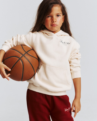 Katie Vendome LA Kids Hoodie - Cream: a soft, fleece-lined hoodie with a kangaroo pocket and Sporty & Rich text.