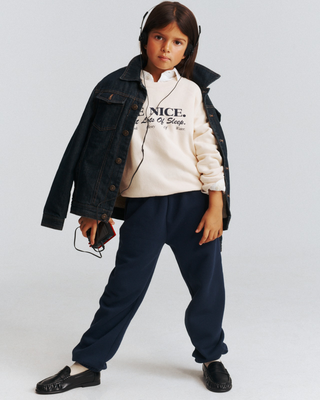 Kais NY Crest Kids Jogger in dark navy cotton polyester with a white crest emblem on the hip.