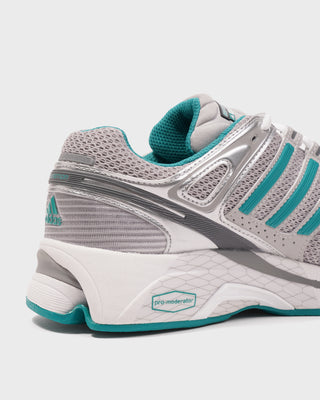 Gray and teal running shoe on a white background
