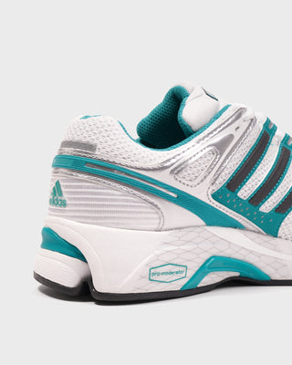 White and teal Adidas running shoe on a white background