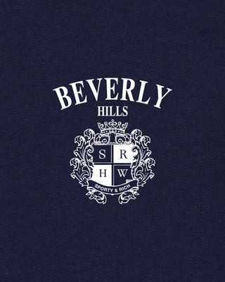 Navy blue shirt with 'Beverly Hills' and crest design on a dark background
