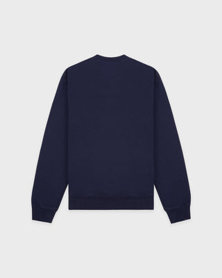 Navy blue sweatshirt on a light gray background