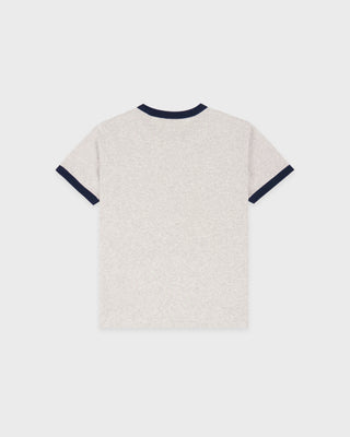 Back view of a textured shirt with navy trim on a light gray background