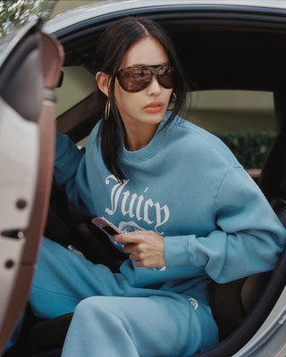 woman in a Juicy crewneck