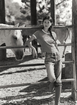 Fatou Riding Club Ringer Tee in Kelly/White with a vintage athletic horse and rider graphic on the chest.