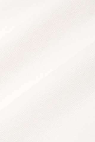 Ecru white Cadillac x Sporty & Rich Tamia Hoodie with a front pocket and a small blue circular logo on the upper left chest, laid flat on a white background. Crafted from premium USA-grown cotton for exceptional comfort and style.