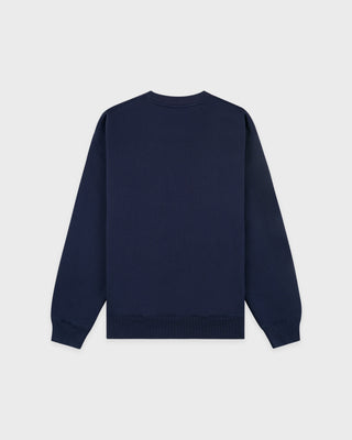 Cadillac x Sporty & Rich Payton Sweatshirt in navy blue, featuring a small white circular logo on the left chest, displayed on a white background.