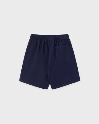 Navy blue Cadillac x Sporty & Rich Franko Gym Shorts featuring an elastic waistband and a small white circular logo on the left leg, crafted from premium USA-grown cotton in a court-inspired silhouette for the perfect blend of comfort and sporty style.