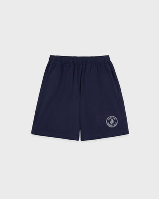 Navy blue Cadillac x Sporty & Rich Franko Gym Shorts featuring an elastic waistband and a small white circular logo on the left leg, crafted from premium USA-grown cotton in a court-inspired silhouette for the perfect blend of comfort and sporty style.