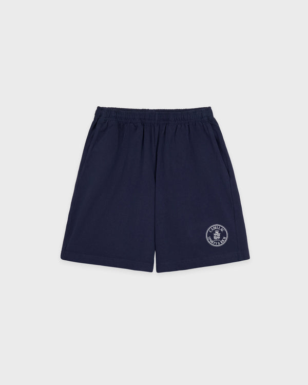 Navy blue Cadillac x Sporty & Rich Franko Gym Shorts featuring an elastic waistband and a small white circular logo on the left leg, crafted from premium USA-grown cotton in a court-inspired silhouette for the perfect blend of comfort and sporty style.