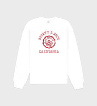 The California Emblem Crewneck - White/Ruby features red Sporty & Rich Los Angeles California text and a round chest logo, made from shrink-free, USA-grown cotton for lasting comfort.