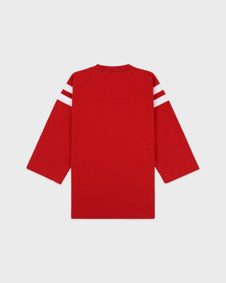 Red hockey jersey with white stripes on sleeves against a light gray background