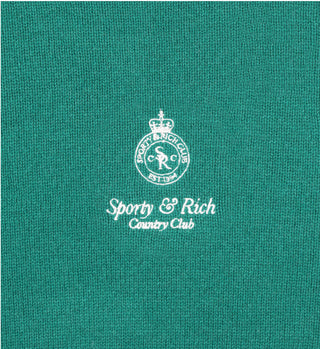 The Crown Cashmere Crewneck - Green features a stylish cropped fit with white “Sporty & Rich Country Club” logo and emblem embroidered at the center.
