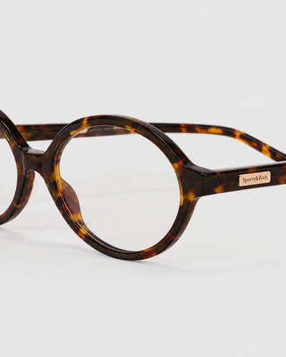 Frame N.11 - Blue Light Glasses - Tortoise, featuring oval tortoiseshell frames with clear lenses, displayed on a plain white background.