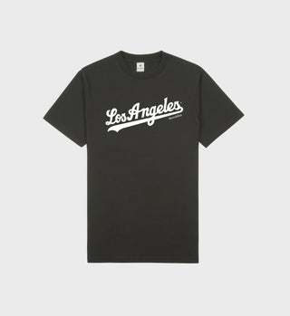 The Dodgers T-Shirt in faded black/white boasts Los Angeles in white cursive on the front. Made from USA-grown cotton and crafted in Los Angeles, it promises a shrink-free fit wear after wear.