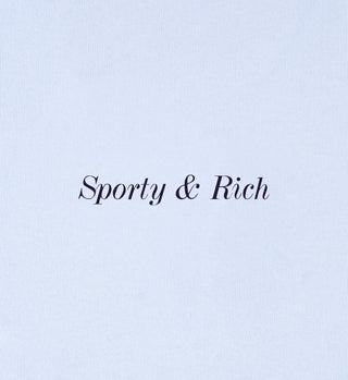 Text Eden Crest T-Shirt - Ciel/Navy in an elegant font, centered on a light blue background, highlighting an oversized t-shirt crafted in Portugal from 100% cotton.