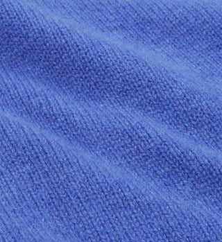 Close-up of soft, medium blue and white lambswool fabric with textured patterns and horizontal ridges, highlighting the high quality of the SRC Wool Crewneck - Medium Blue/White. Made in Italy.