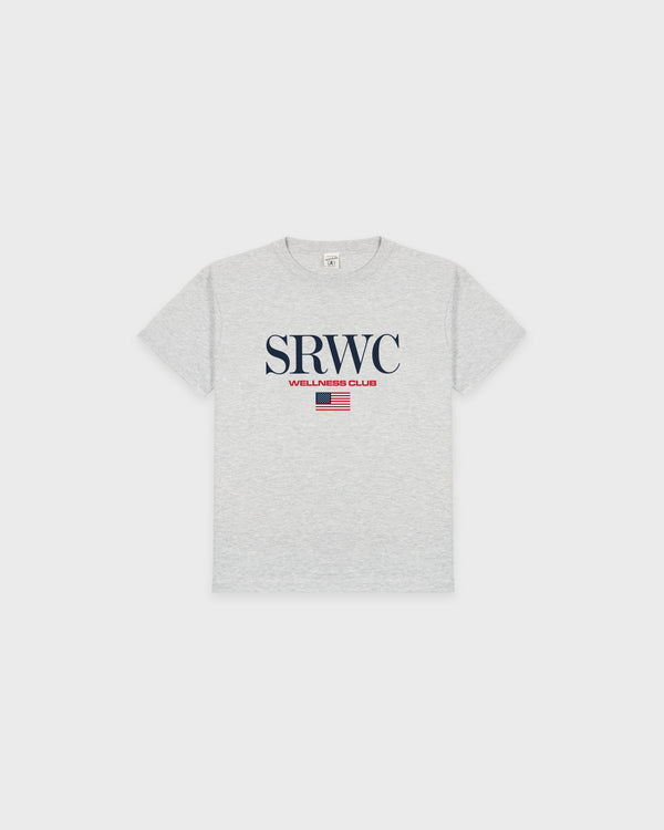 Nautical Kids T-Shirt - Heather Gray is crafted from recycled cotton and features "SRWC WELLNESS CLUB" along with a small red striped flag printed on the front. It’s designed with an oversized fit for a modern look.