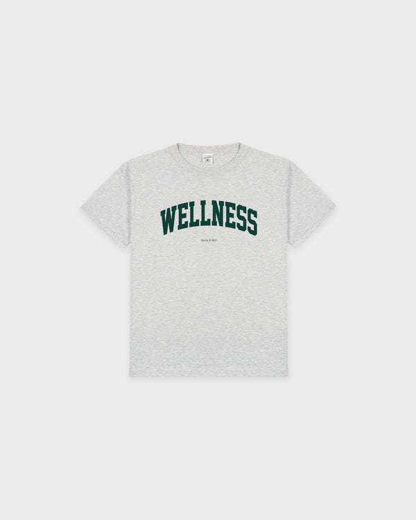 Wellness Ivy Kids T-Shirt in Heather Gray/Forest, made from recycled cotton for a sustainable touch, featuring "WELLNESS" printed in large forest green letters across the chest and displayed flat on a white background.