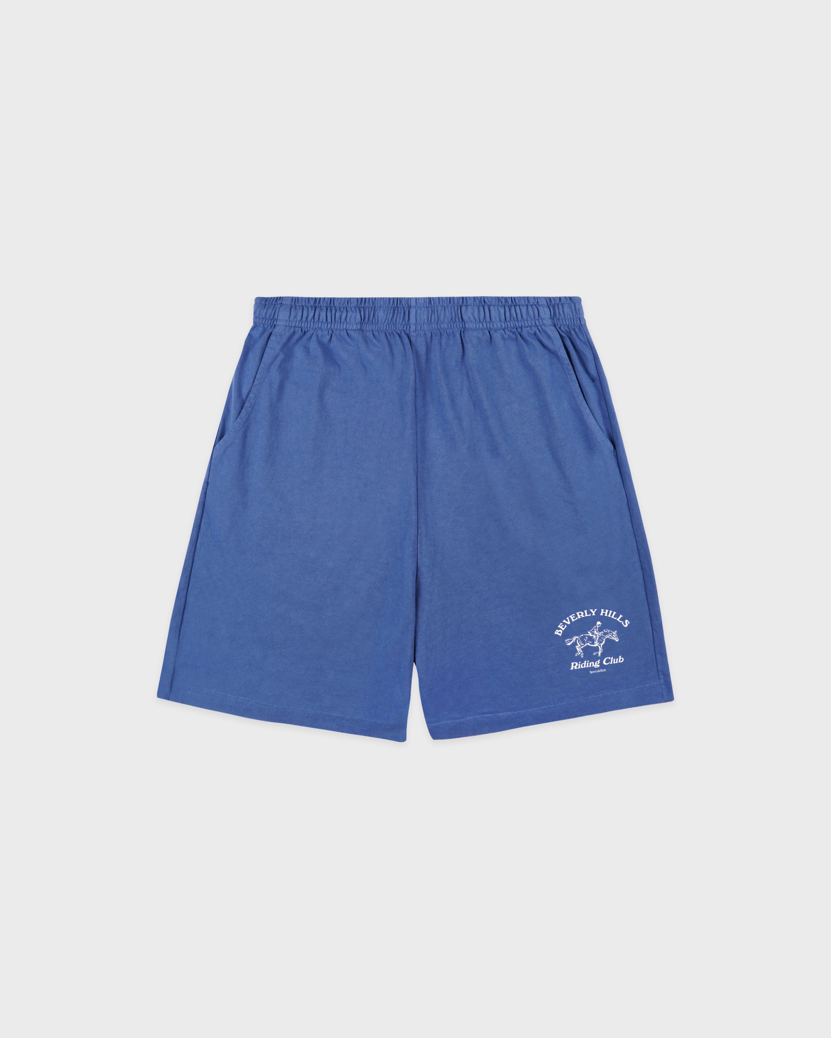 Blue shorts with a logo on a light gray background